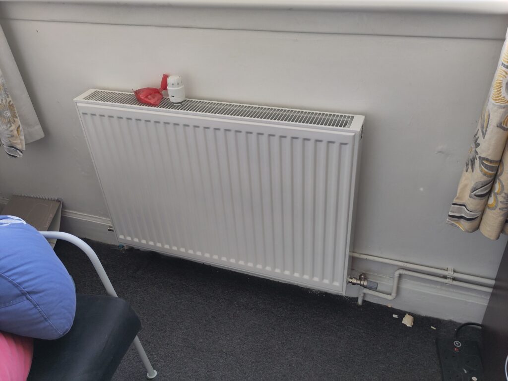 New radiator hung on the wall.