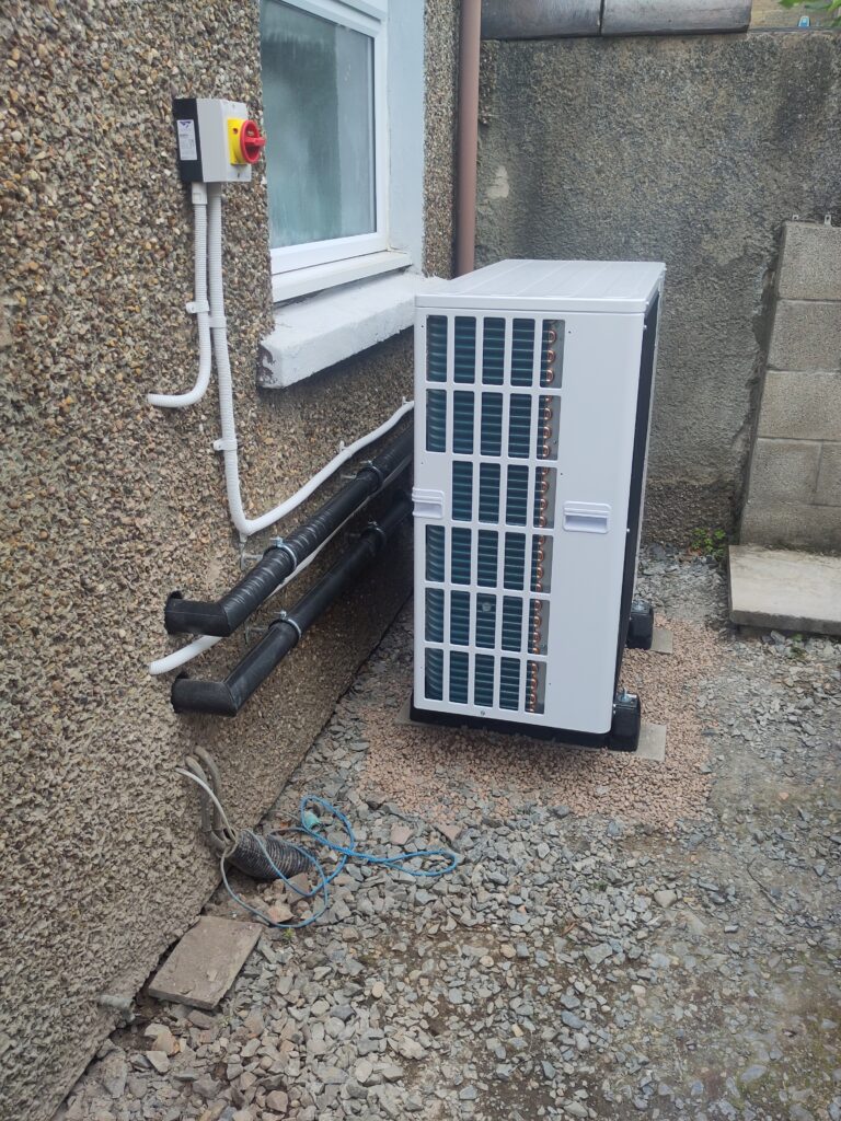 Heat pump now in place, side view.